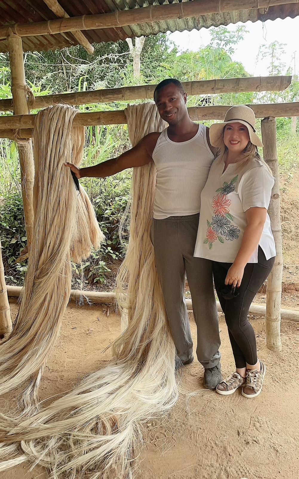 two people posing next to abaca fiber